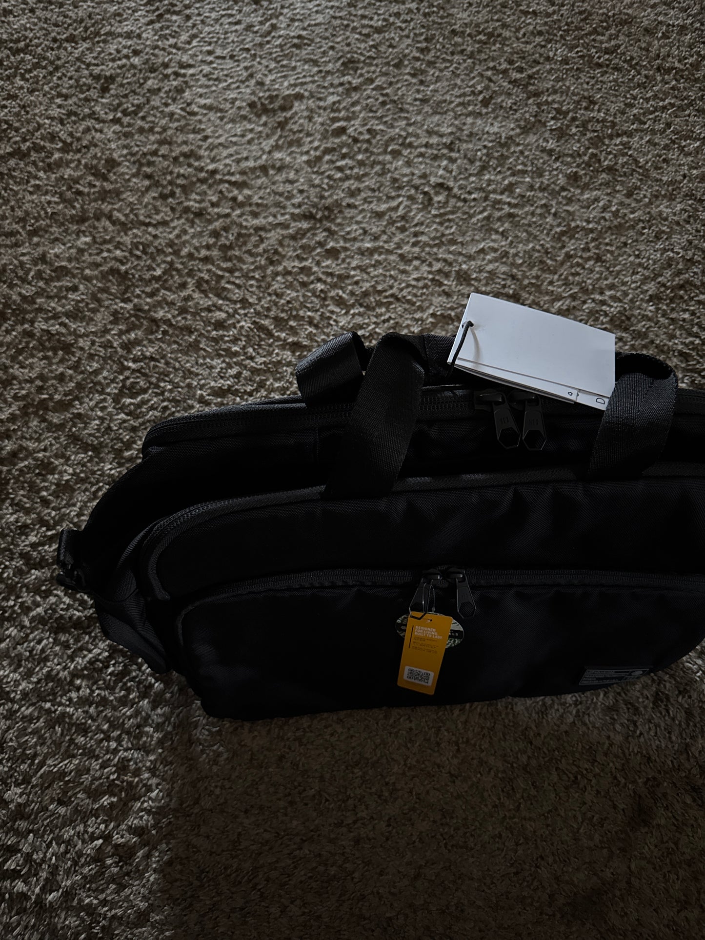 Ballistic nylon water resistant super rugged briefcase bag with multiple pockets, fur lined laptop pocket, waterproof side pocket, removable shoulder strap, and tons of storage