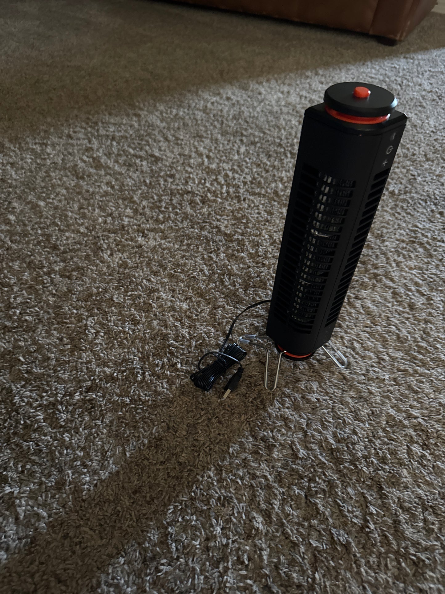 Portable USB powered tower fan with easy touch controls, ability to use standing up or lying flat, swivel base, and small size for travel