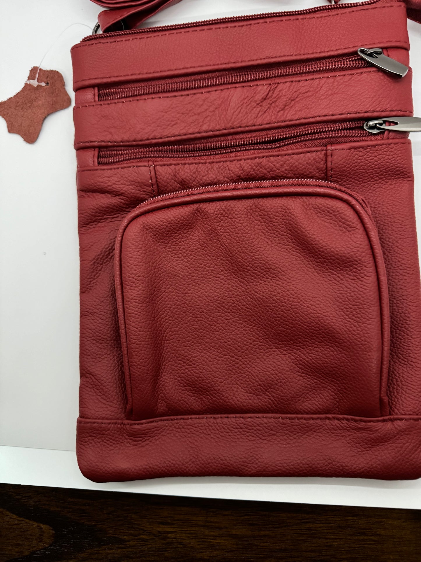 Stylish Unisex Genuine Leather Cross Body Bag With RFID Protection, Adjustable Shoulder Strap, 6 Storage Pockets and available in a variety of sizes and colors