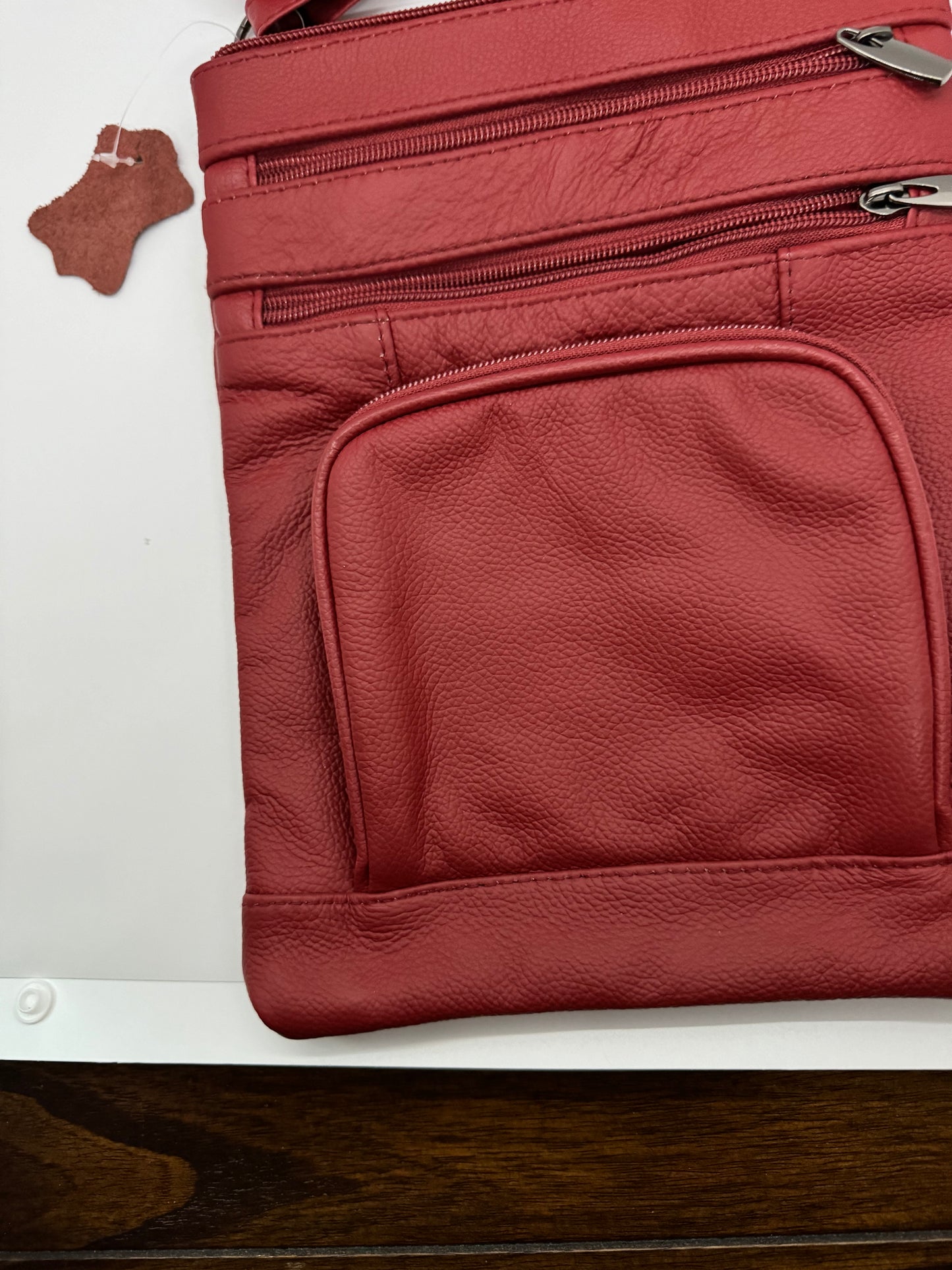 Stylish Unisex Genuine Leather Cross Body Bag With RFID Protection, Adjustable Shoulder Strap, 6 Storage Pockets and available in a variety of sizes and colors