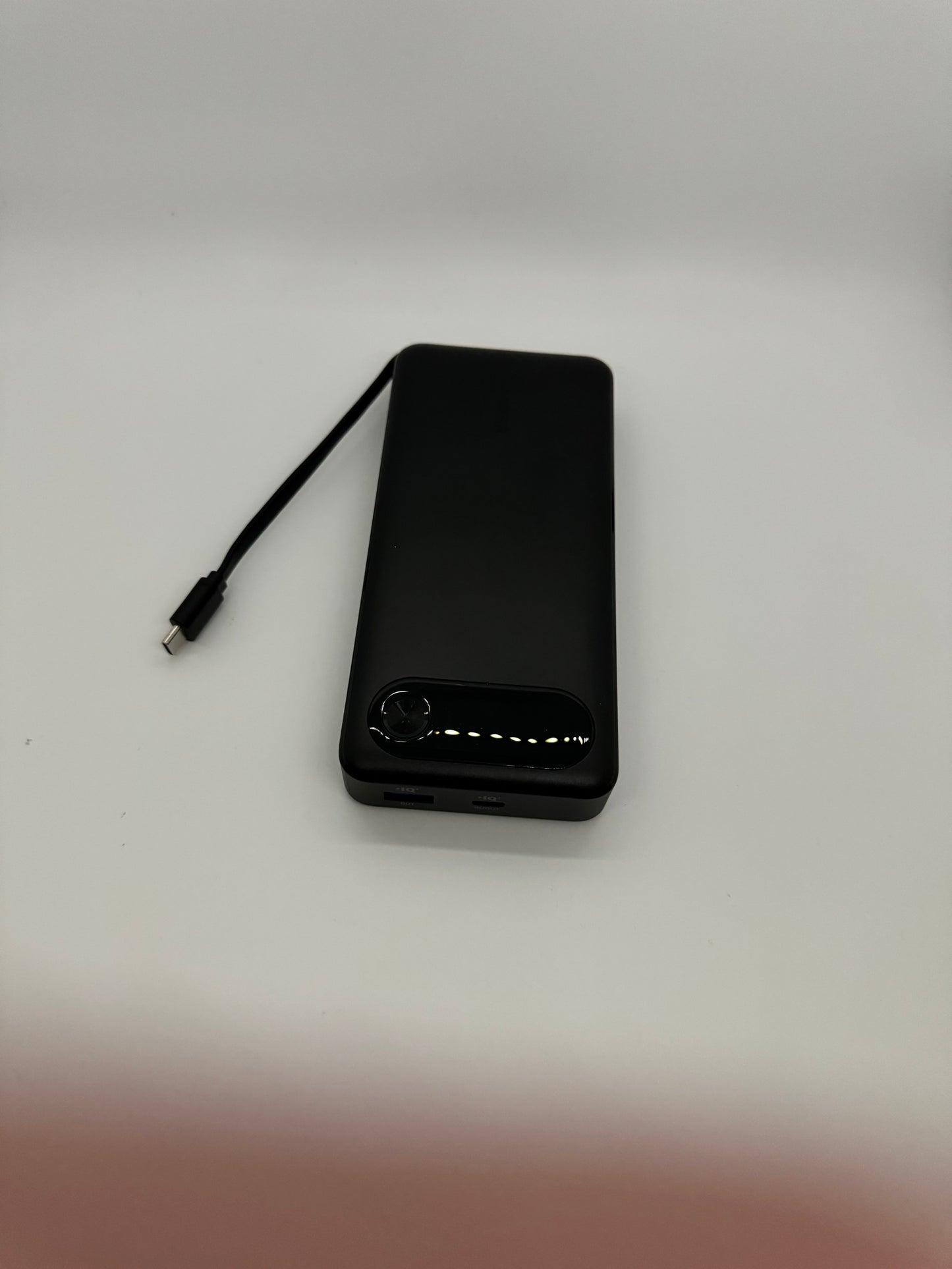 Anker 20,000mAh portable power bank with 87 watts of power, built-in USB-C cable, 2 extra charging ports, and ability to charge up to 3 devices at one time.
