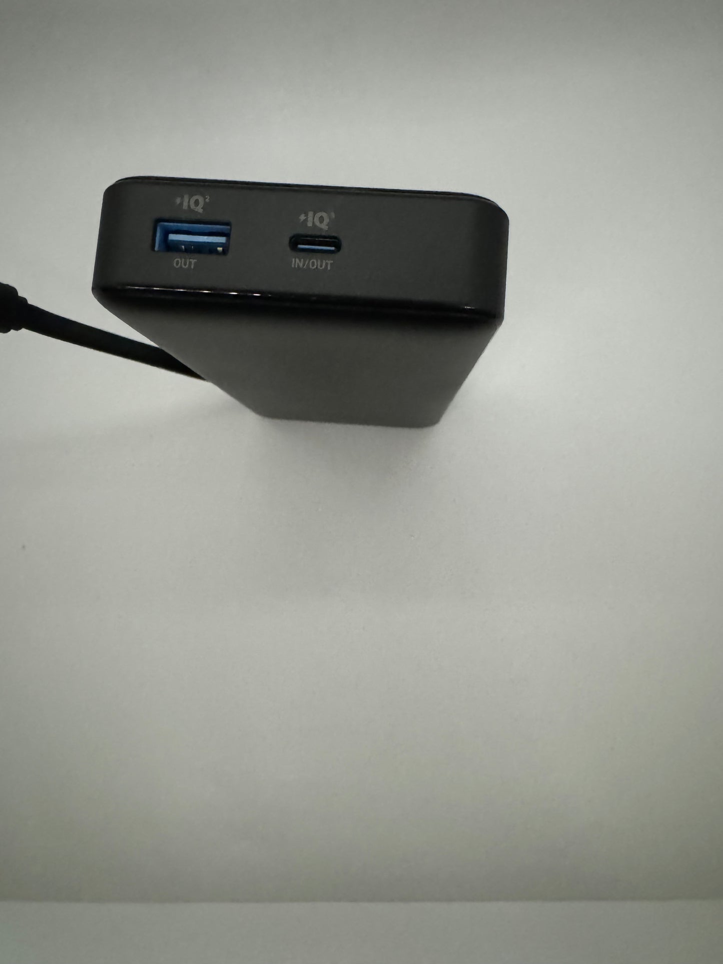 Anker 20,000mAh portable power bank with 87 watts of power, built-in USB-C cable, 2 extra charging ports, and ability to charge up to 3 devices at one time.