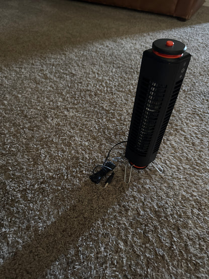Portable USB powered tower fan with easy touch controls, ability to use standing up or lying flat, swivel base, and small size for travel