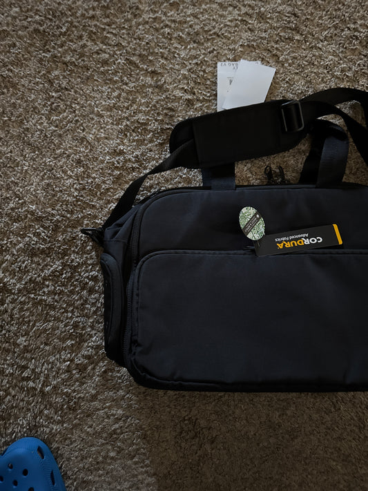 Ballistic nylon water resistant super rugged briefcase bag with multiple pockets, fur lined laptop pocket, waterproof side pocket, removable shoulder strap, and tons of storage