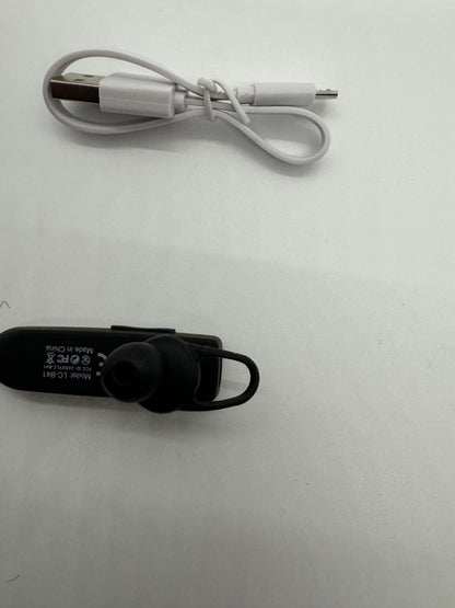 The picture shows two items on a white background. 1. On the left side, there is a white cable. It appears to be a USB cable with a standard USB connector on one end and a micro USB connector on the other. The cable is neatly folded and has a small white rubber band holding it together.2. On the right side, there is a black Bluetooth earpiece. It has a small earbud, a clip to attach to the ear, and a flat surface that likely contains controls or a microphone. There is some text on the flat sur