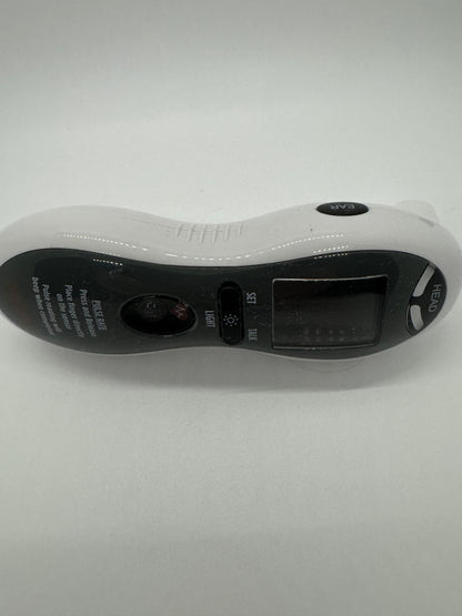 The picture shows a white handheld device with a curved shape. On the top side, there is a black button with the word "EYE" written on it. The device has a small screen, possibly an LCD display, and below the screen, there is a black area with text and symbols, but it's not clear enough to read. There are also two small red buttons, one labeled "LIGHT" and the other is not legible. The device seems to be some sort of electronic gadget, possibly used for reading or magnification.