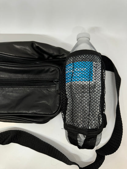 The picture shows a black waist bag (fanny pack) with a water bottle attached to it. The waist bag is made of black leather and has a zippered compartment. The water bottle is in a black mesh holder that is attached to the waist bag. The bottle appears to be made of plastic and has a white cap. The mesh holder has a blue pattern visible through it, which seems to be the color of the water bottle. There is also a black strap with a woven texture, which is likely part of the waist bag's belt. The ba