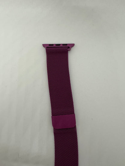 Be My AI: The picture shows a watch band. It is a deep pink or magenta color. The band is made of a woven material and has a loop to secure the excess strap. At the top, there is a rectangular attachment with three holes, which is likely used to connect the band to a watch face. The background is plain white.