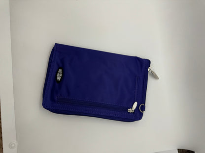 The picture shows a blue pouch or small bag. It is made of a fabric material and has a zipper on the top right corner with a silver zipper pull. There is also a smaller zipper on the front side with a similar silver zipper pull. The background is plain white.
